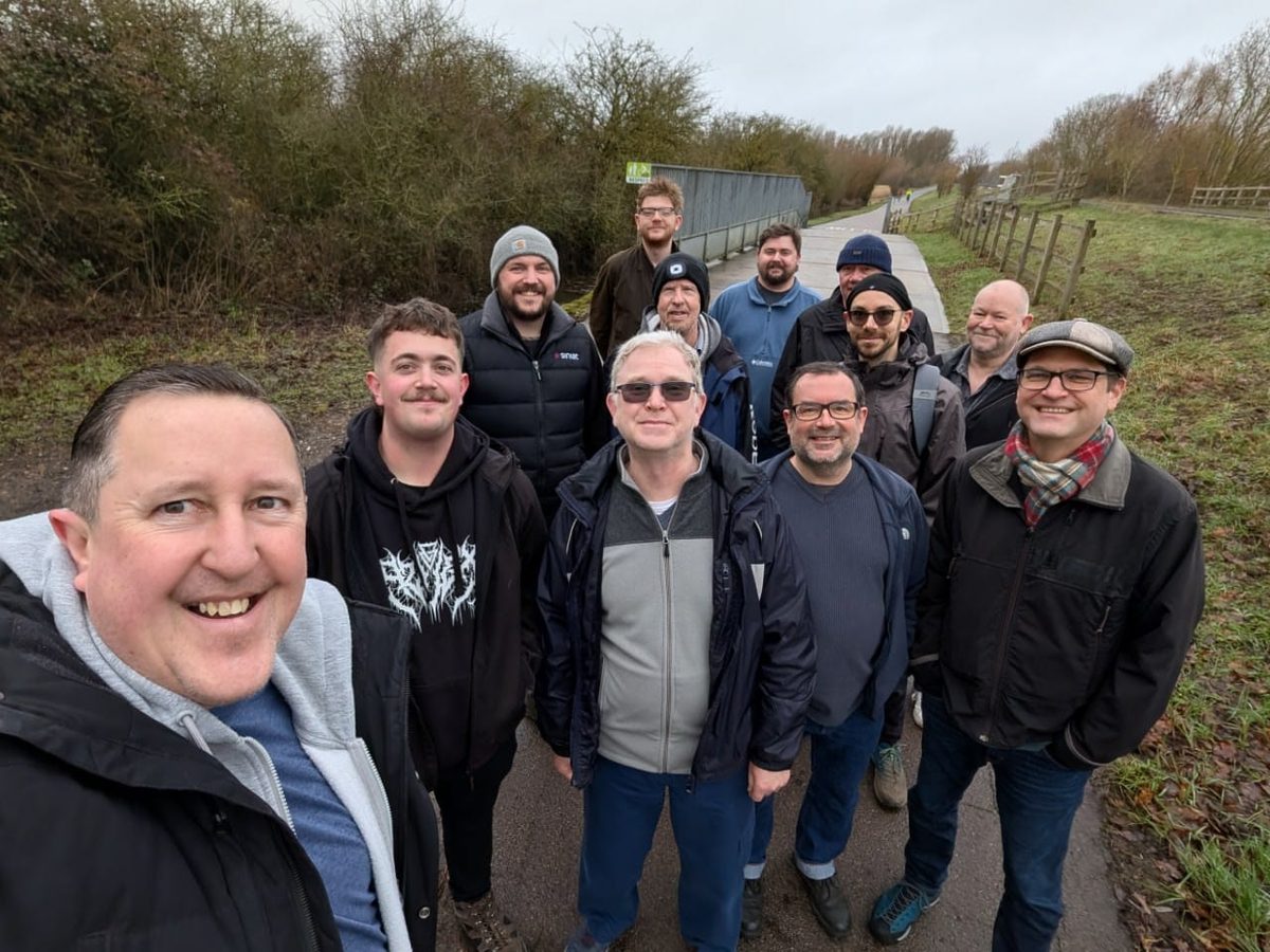 Men on a footpath outside St Ives on a grey winter morning walk.